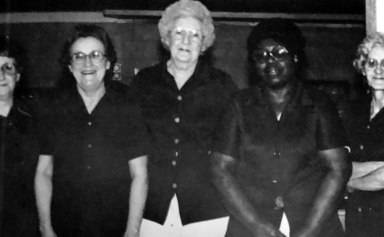 The lunchroom ladies from columnist John Moore’s high school days pose for a photo between serving kids their pizza and milk. Photo by John Moore