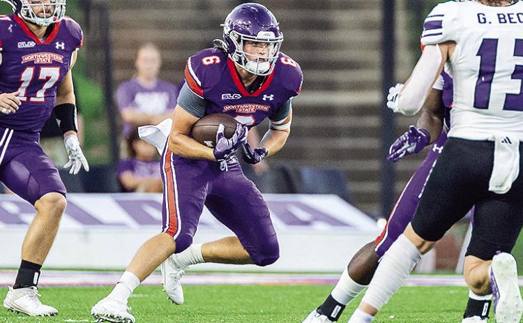 Ty Moore (6) returns a kick against Weber State on Sept. 21. Photo by Chris Reich/NSU Photographic Services