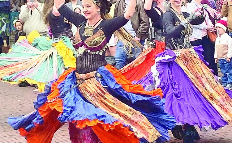 Indigeaux bellydancers always draw a crowd when they turn the bricks into a dance floor for an energizing performance.